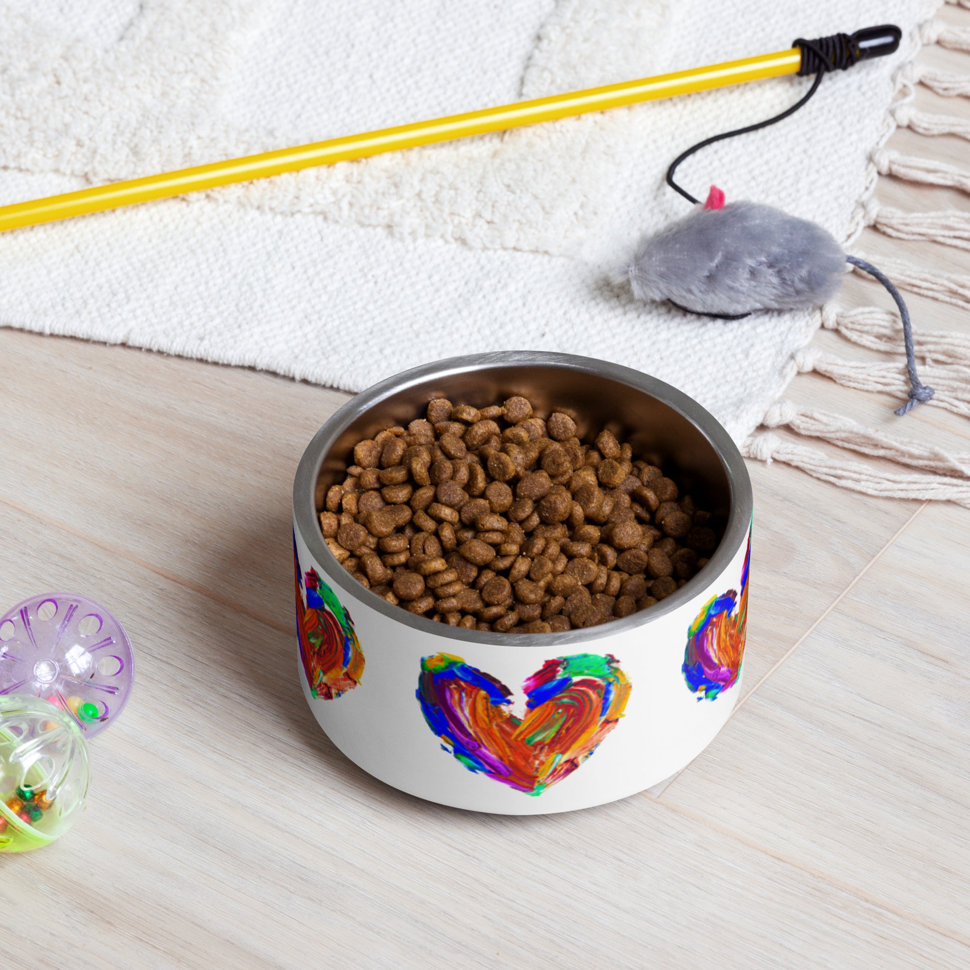 pet bowl figuring several painted coloured hearts on a white background 